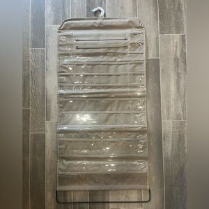 Jewelry organizer with two sides and a swivel hanger